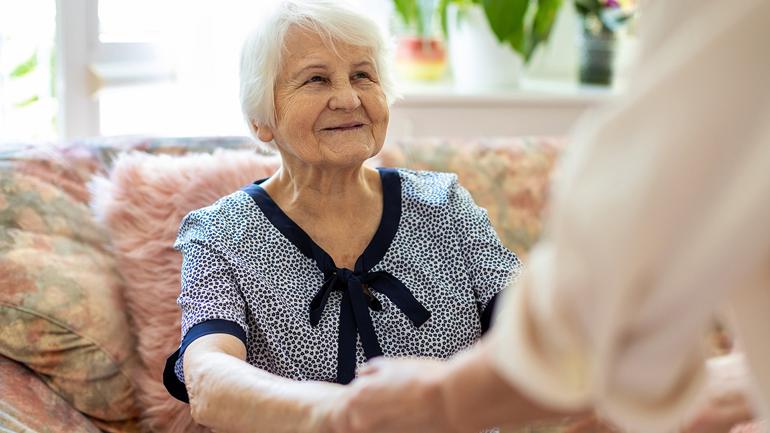 A senior woman with her caregiver